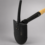 Close-up of Council Tool Combi Tool showing shovel blade, pick and locking mechanism