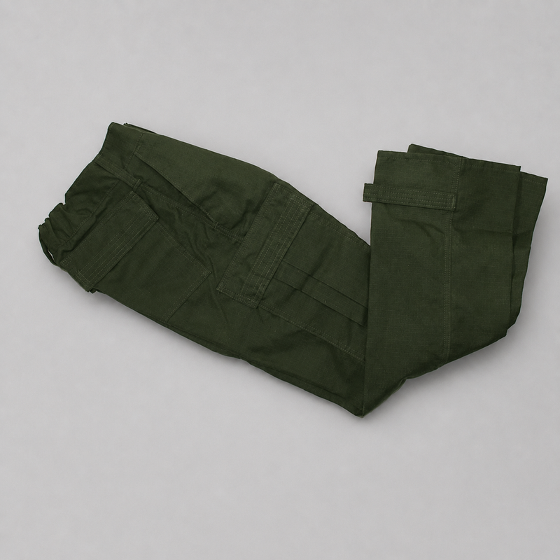 A pair of spruce green cargo pants folded neatly on a light gray background.