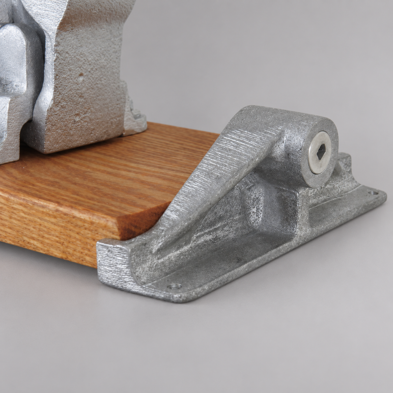 Close-up of the quick-release ball-and-socket bracket securing a Hebert hose clamp