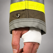 Close-up of the INNOTEX RDG20 coat’s gray reinforced cuff, reflective sleeve trim and white wristlet with thumb opening.