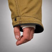 Close-up of the INNOTEX RDG40 coat’s sleeve cuff with black edging and a white wristlet with thumb opening.