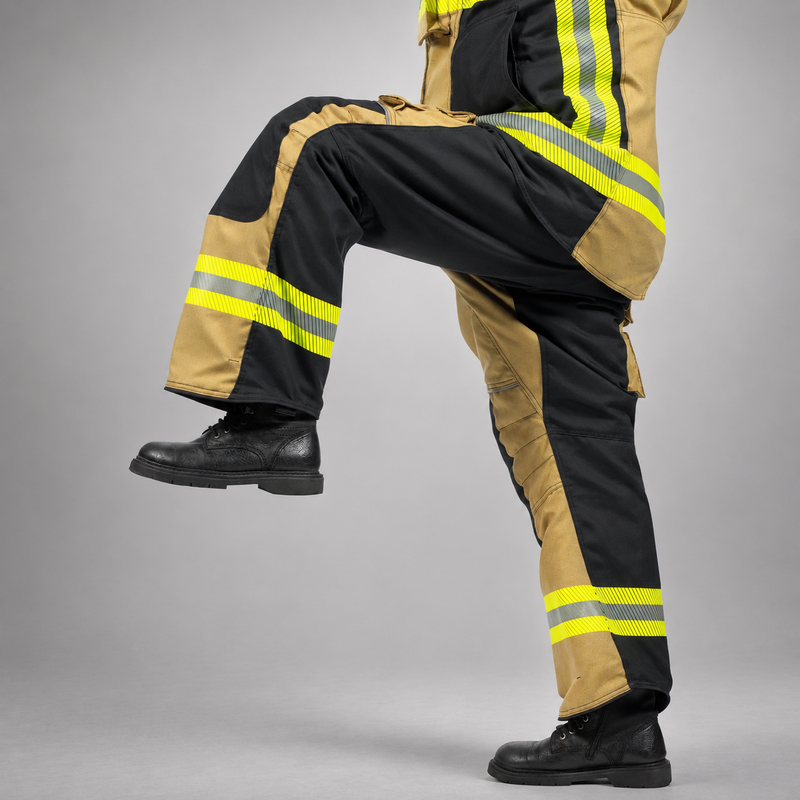 Side view of a firefighter lifting one knee while wearing gold-and-black RDG60 turnout pants.
