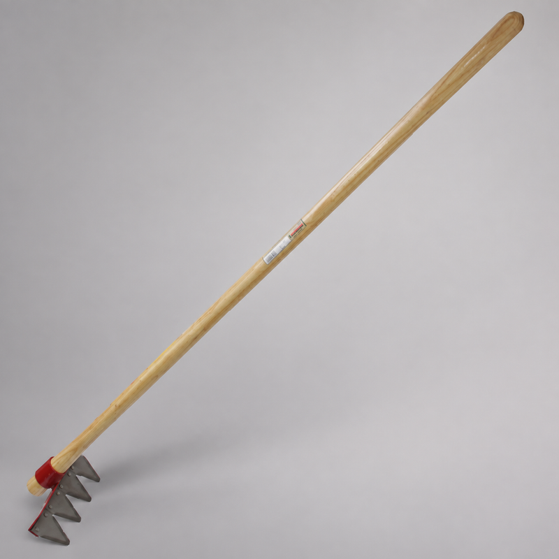 Mower blade rake with a long wooden handle and four triangular steel cutting teeth