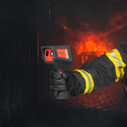 Firefighter using Seek AttackPRO 300 thermal imaging camera during structural firefighting operations