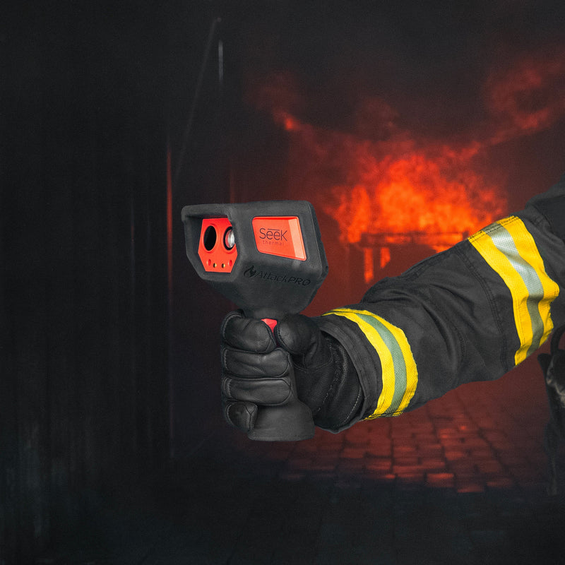 Firefighter using Seek AttackPRO 300 thermal imaging camera during structural firefighting operations