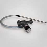 Akron Brass 3060 60 GPM Pyrolite in-line foam eductor with pickup hose and wand on soft gray studio background