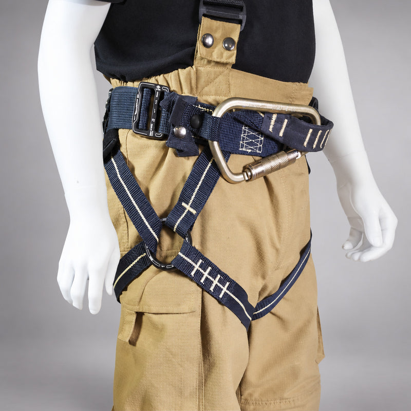 Fire Innovations Apache Cobra NFPA Class II harness worn over turnout pants on a gray studio background