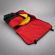 Red Strike Team Applegate Hose Pack fully opened to show coiled yellow wildland hose and hook-and-loop closure panels.
