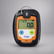 Dräger Pac 6000 SO2 single-gas detector on a warm gray studio background