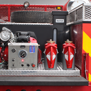 Two drip torches mounted upright on a fire truck