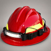 A red firefighter helmet with a bright yellow reflective band, a black chin strap, and an attached white LED headlamp, shown on a neutral gray background.