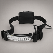 A black tactical headlamp with an adjustable elastic strap and a clear rectangular LED light bar, shown on a neutral gray background.