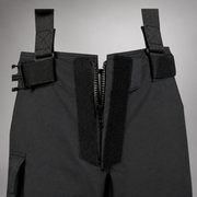 Close-up of the INNOTEX RDG50 pants waist showing the open front zipper, hook-and-loop closure, belt, and attachment straps.