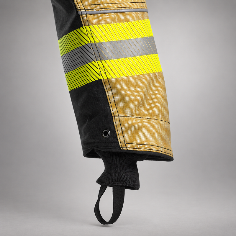 Close-up of the RDG60 coat sleeve showing gold-and-black panels, reflective trim, and a black knit wristlet with loop.