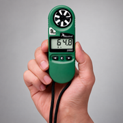 Kestrel 2000 wind and temperature meter held in one hand