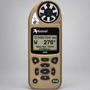 Tan Kestrel 5500 weather meter displaying compass heading