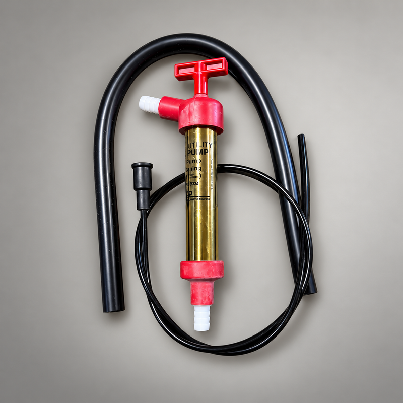 Manual primer kit with red T-handle, brass utility pump, tubing and hoses on a light gray background