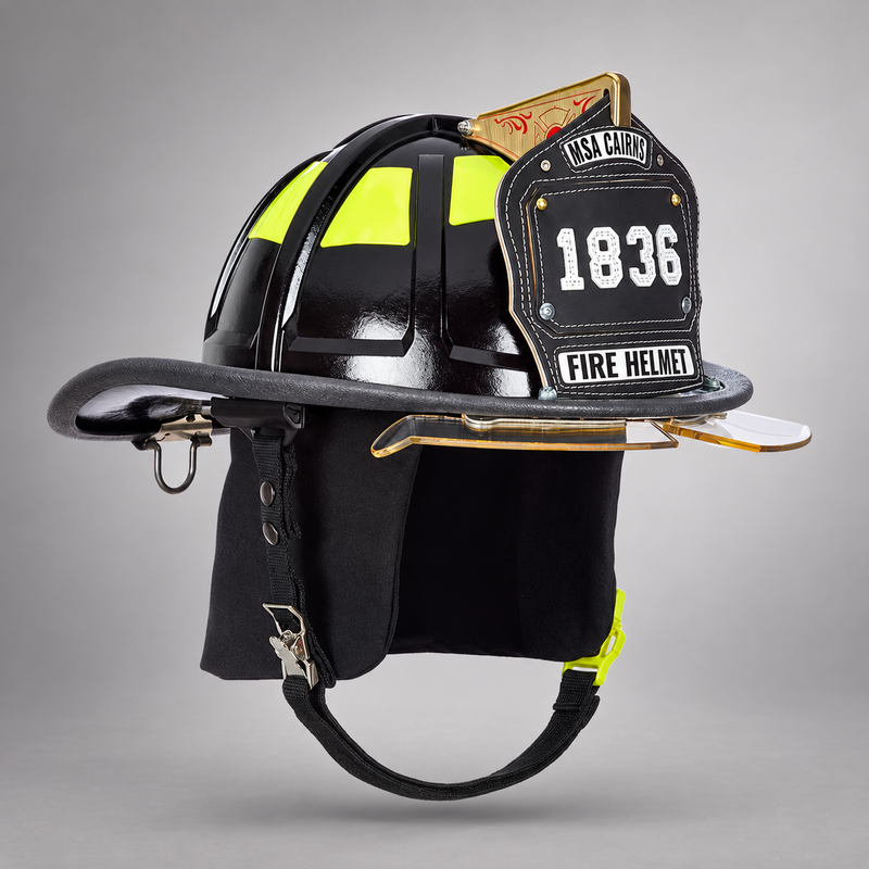 Black MSA Cairns 1836 fire helmet with Bourke eye shields, black Nomex earlaps and Maltese Cross front holder