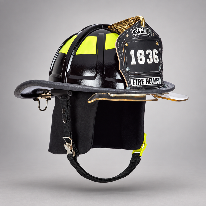 Black MSA Cairns 1836 fire helmet with clear Defender visor, black Nomex earlaps and carved eagle front holder