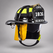 Black MSA Cairns 1836 fire helmet with clear Defender visor, yellow Nomex earlaps and carved eagle front holder
