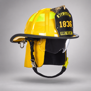Yellow MSA Cairns 1836 fire helmet with clear Defender visor, yellow Nomex earlaps and carved eagle front holder