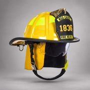 Yellow MSA Cairns 1836 fire helmet with clear Defender visor, yellow Nomex earlaps and silkscreen eagle front holder