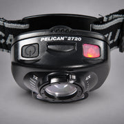Close-up of Pelican 2720 headlamp controls and variable-focus lens