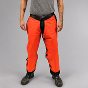 PGI orange forestry chainsaw chaps worn over work clothing