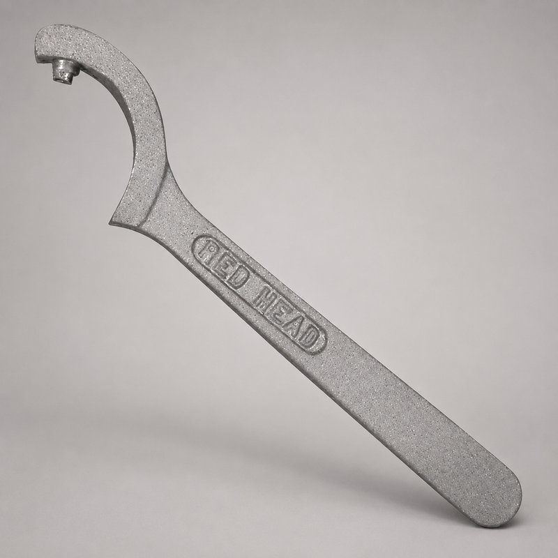 Red Head Brass spanner wrench for ¾-inch and 1-inch pin-hole booster hose couplings.