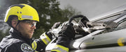 Firefighter working at a vehicle roof with a RESQTEC EDD combi tool
