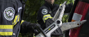 Firefighter using a RESQTEC EDD combi tool on a vehicle