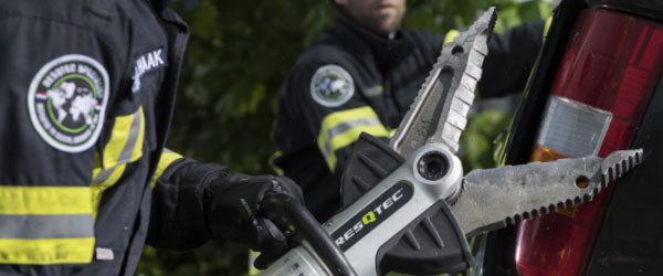 Firefighter using a RESQTEC EDD combi tool on a vehicle
