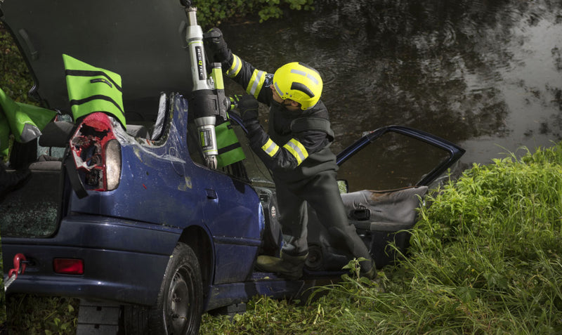 Firefighters using a RESQTEC EDD ram during vehicle extrication