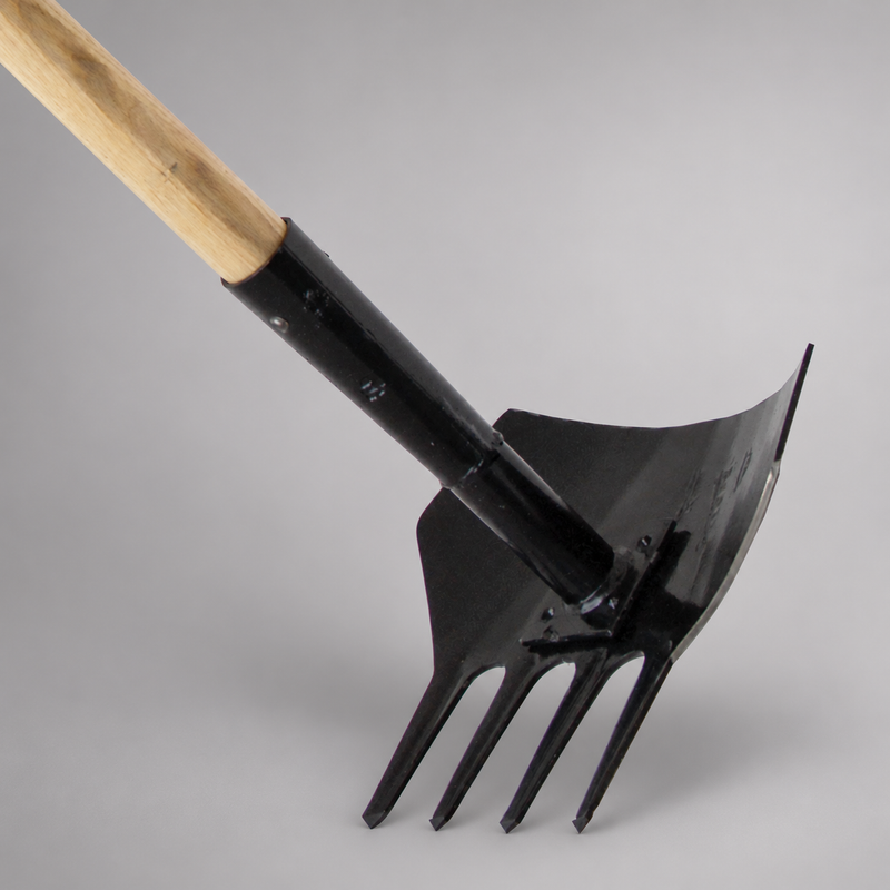 Close-up of the Shasta tool’s black curved shovel blade and four rake tines