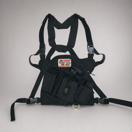 A black firefighter chest rig harness with shoulder straps, waist straps, and a front pouch containing a red and white 'Strike Team Fire Gear' patch, photographed against a neutral light gray background.