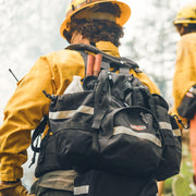 Firefighter wearing a loaded True North Bushwhacker pack