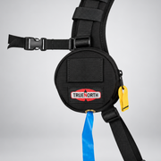 True North flagging tape dispenser attached to a wildland pack shoulder harness