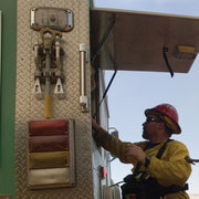 Cascade hydrant wrench and spanner holder mounted vertically on fire apparatus