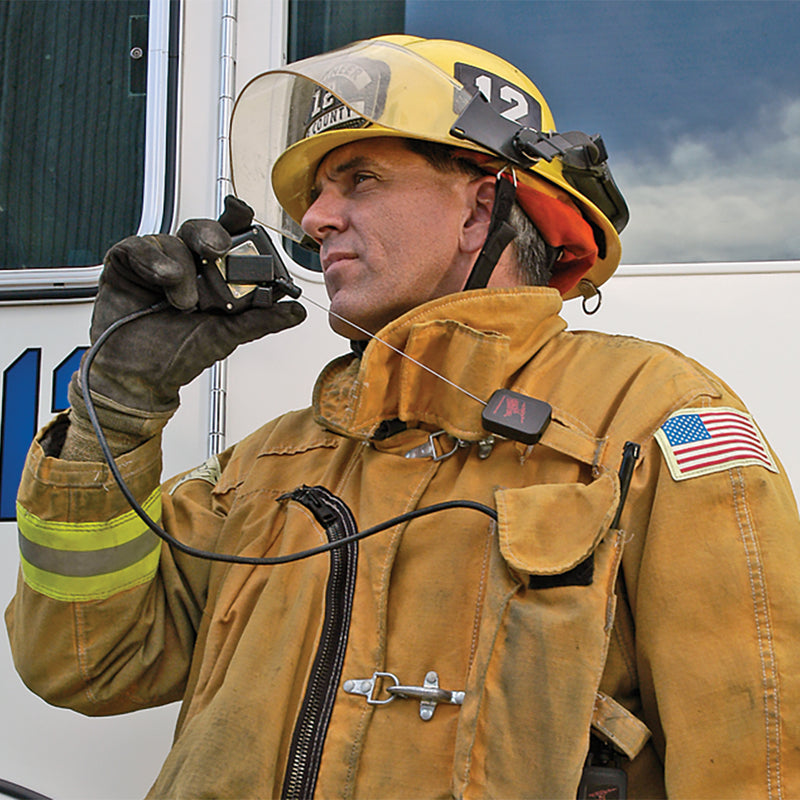 Firefighter using a radio microphone attached to a Gear Keeper Fire Mic Keeper