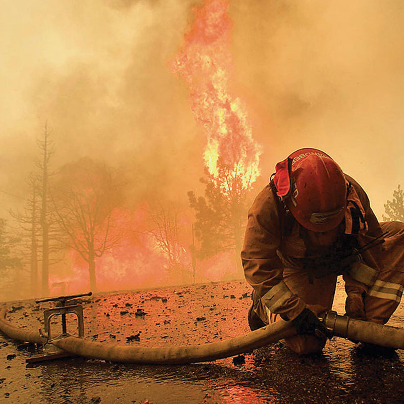 Hebert hose clamp installed on a fire hose during wildland firefighting operations