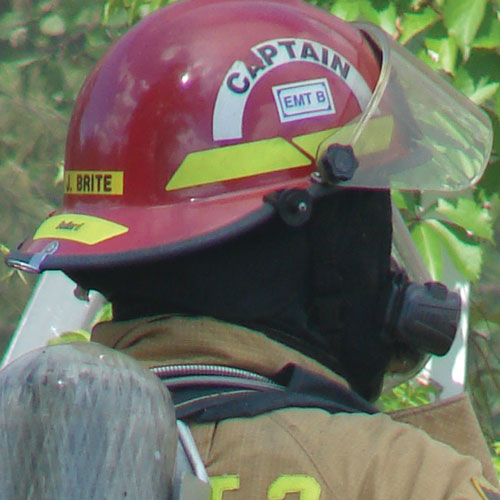 Captain helmet crescent on a firefighter’s red helmet; application example