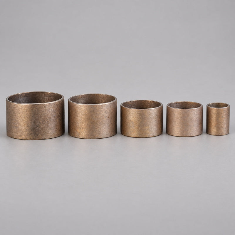 Five red brass hose coupling expansion rings in graduated sizes