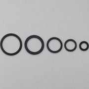 Black hose swivel gaskets in five sizes on a gray background