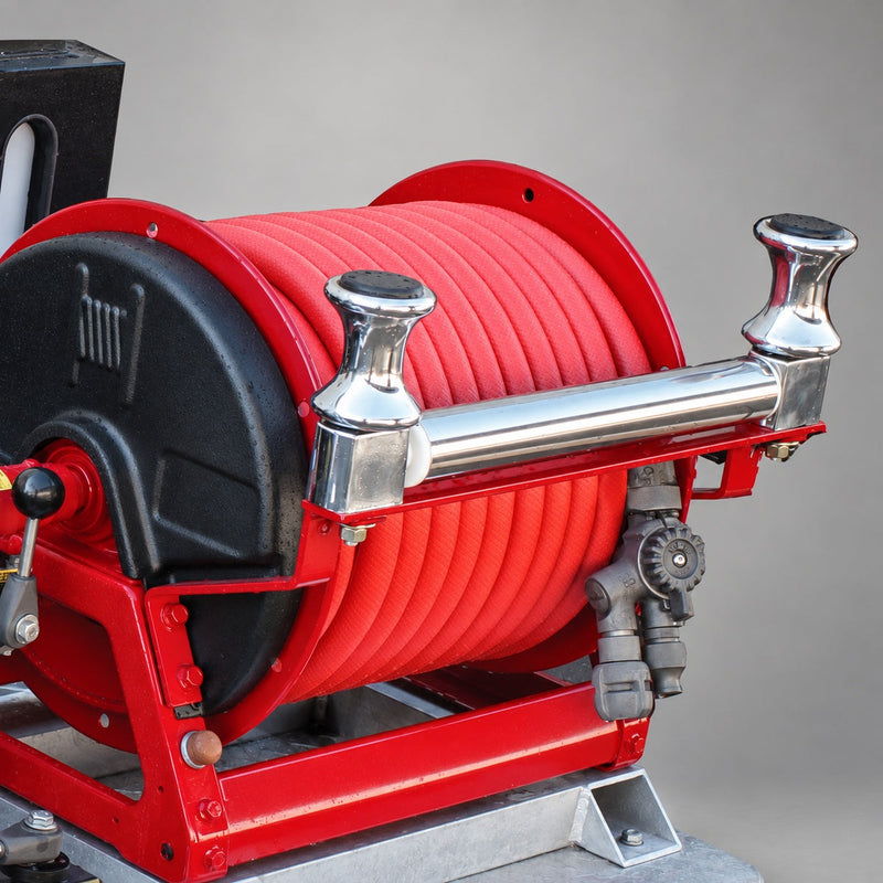 Medium-pressure red booster hose wound on a reel; reel shown for demonstration