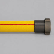 Yellow Outback 600 HD forestry hose with red tracer stripe and metal coupling