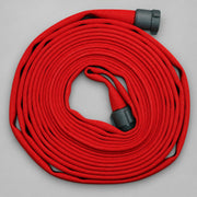 Coiled red fire hose with couplings shown for swivel gasket reference