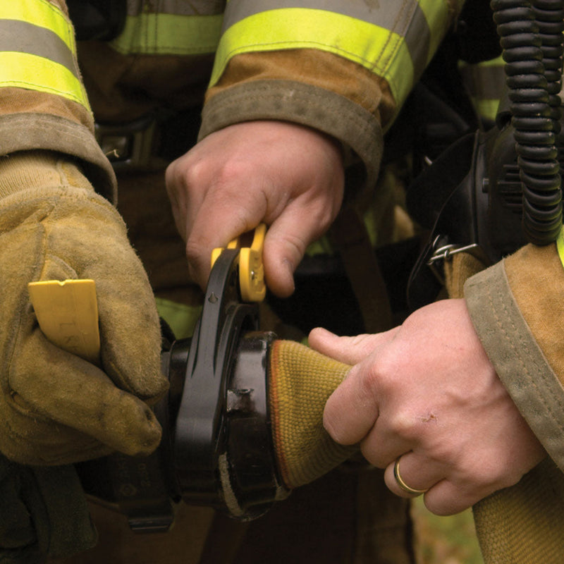 Firefighter using a Res-Q-Rench on a fire hose coupling