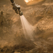 S&H Twin Tip Forestry Nozzle applying a fog pattern to burned ground