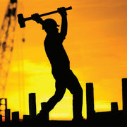 Firefighter using a sledge hammer during structural firefighting or forcible-entry work.