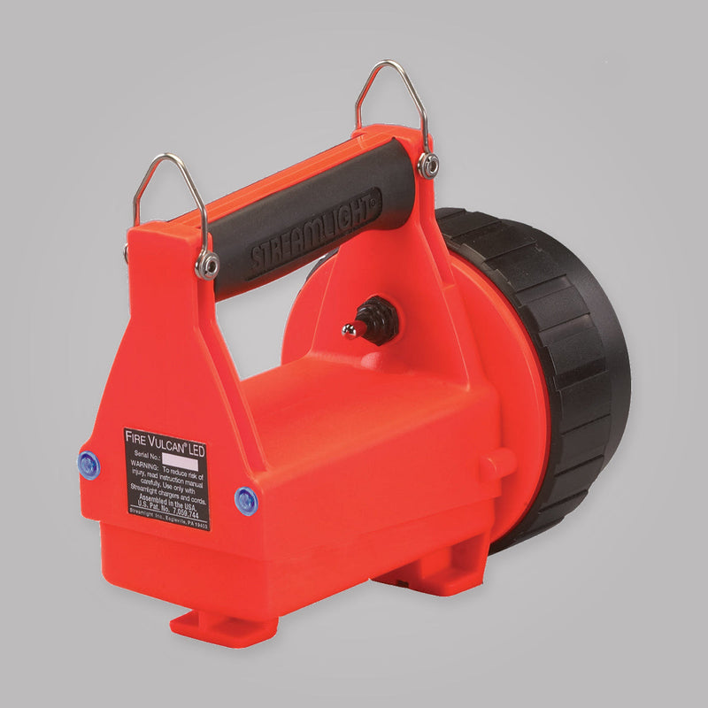Rear view of orange Streamlight Fire Vulcan LED lantern showing two blue taillights and toggle switch